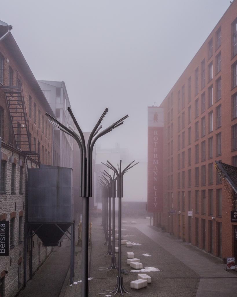 Rotermann, Tallinn. Repurposed old industrial quarters in a harmonious ensemble with new office and apartment buildings. The fog lets it feel bigger and more powerful than it already is.