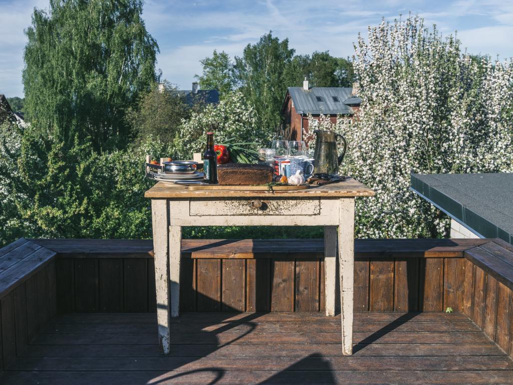 Supilinn, Tartu. The Japanese moment of Estonia — instead of the cherries blossoming — the apple trees signal us the beginning of summer. We move outdoors, to cook and to eat, to read and to sleep. This is a rooftop terrace on top of a wood shed—summer literally throning above winter.