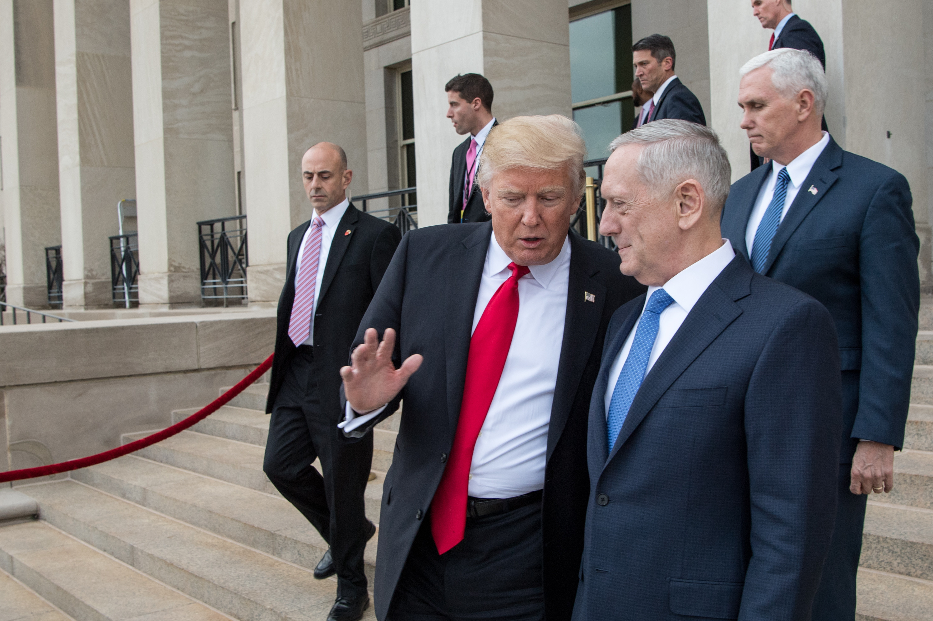 SecDef James Mattis (middle) leaving the Pentagon with president Donald Trump and vice president Mike Pence.