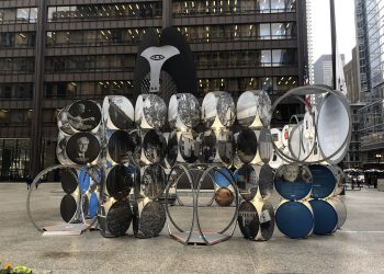 The Masters of Our Own Homes travelling exhibition at Daley Plaza in Chicago. The Chicago Picasso, an untitled monumental sculpture by Pablo Picasso, is in the background. Photo by Sten Hankewitz.