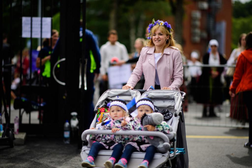 A woman with two children at Estonian Song Celebration in 2019. Photo by Sven Zacek.