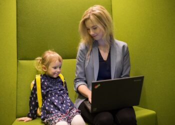 A mother and a child in a modern office in Estonia; photo by Renee Altrov.
