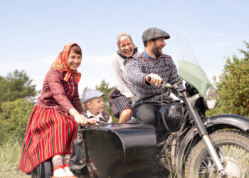 A family in Estonia’s Kihnu island enjoying a motorcycle ride. The image is illustrative. Photo by Renee Altrov.