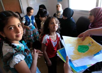 Refugee children from Syria at a clinic in Ramtha, northern Jordan. Photo by Russell Watkins/The UK’s Department for International Development. Shared under the Creative Commons CC BY 2.0 licence.