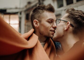 A gay couple kissing. Photo by Renate Vanaga on Unsplash.