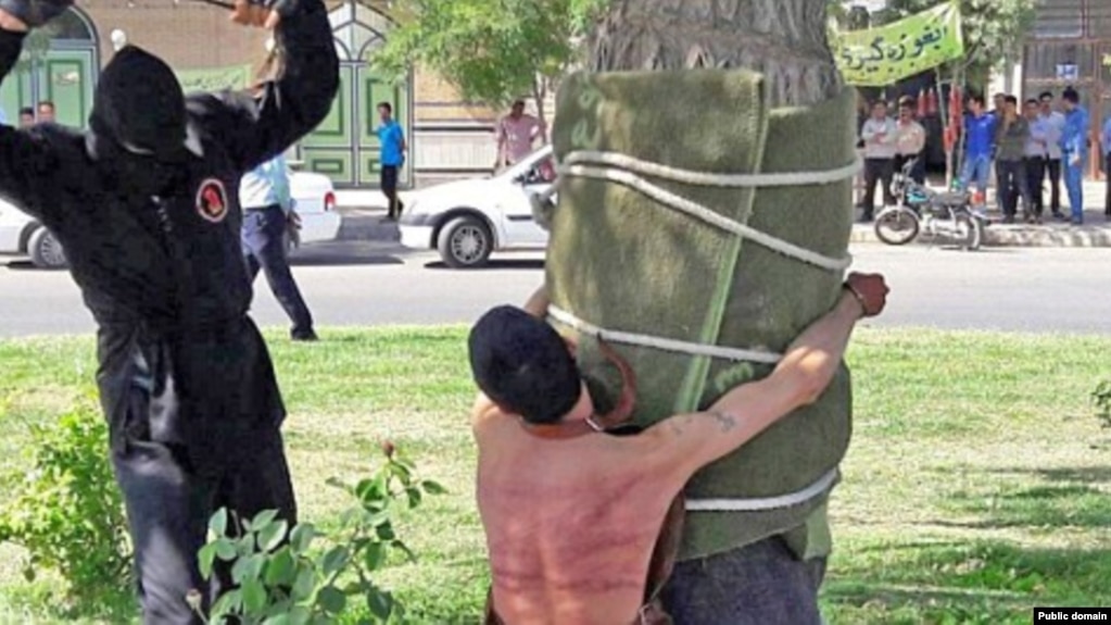 The public flogging of a man convicted of consuming alcohol in Iran. Photo by Amnesty International.