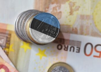 Euro coins painted in the Estonian tricolour. Picture by Shutterstock.