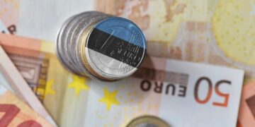 Euro coins painted in the Estonian tricolour. Picture by Shutterstock.