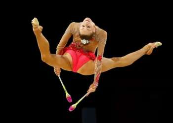 Carmel Kallemaa, a Toronto-based Estonian-born gymnast, won a gold in the rhythmic gymnastics team event at the Commonwealth Games in Birmingham, UK, as part of the Canadian squad; she also won a silver in the clubs event and bronze medals in both the ribbon and hoop events. Photo from the official Commonwealth Games 2022 gallery.