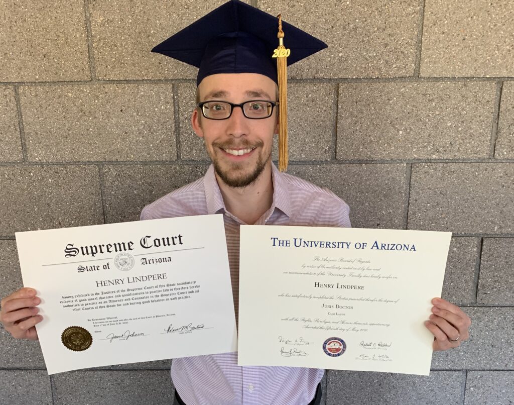 Henry Lindpere in July 2020 with his juris doctor diploma and Arizona Supreme Court certificate of admission. Private collection.