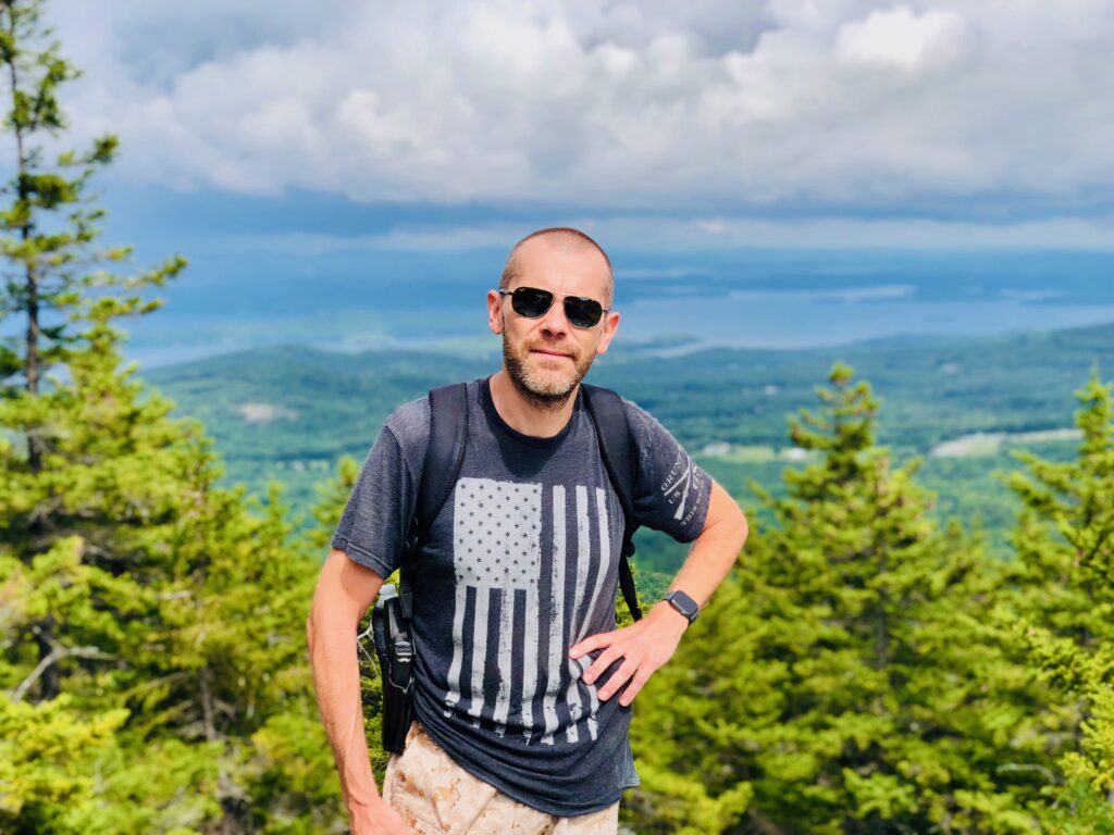 Sten lives in New England and is an avid hiker. Here, at the summit of Mount Belknap in New Hampshire. Photo by Ingrid Hankewitz.