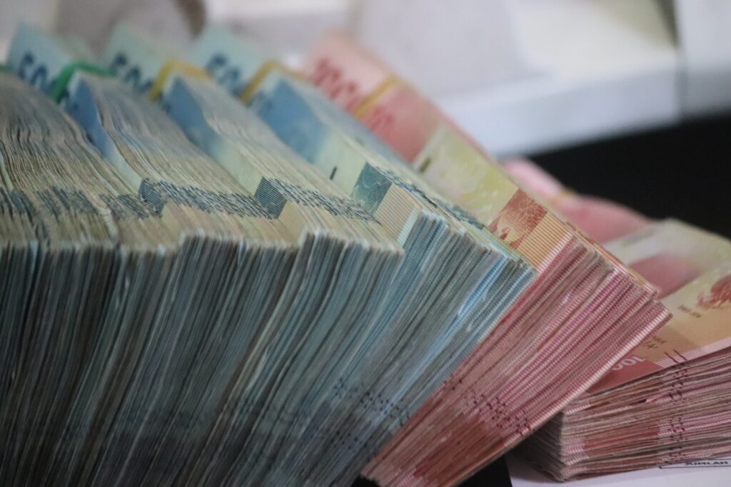 Wads of euro cash. The photo is illustrative. Photo by Mufid Majnun on Unsplash.