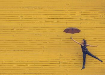 A happy woman. Photo by Edu Lauton on Unsplash.