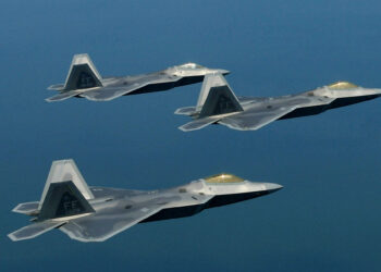 US Air Force’s F-22 Raptors flying in formation. Photo by Samuel Rogers, public domain.