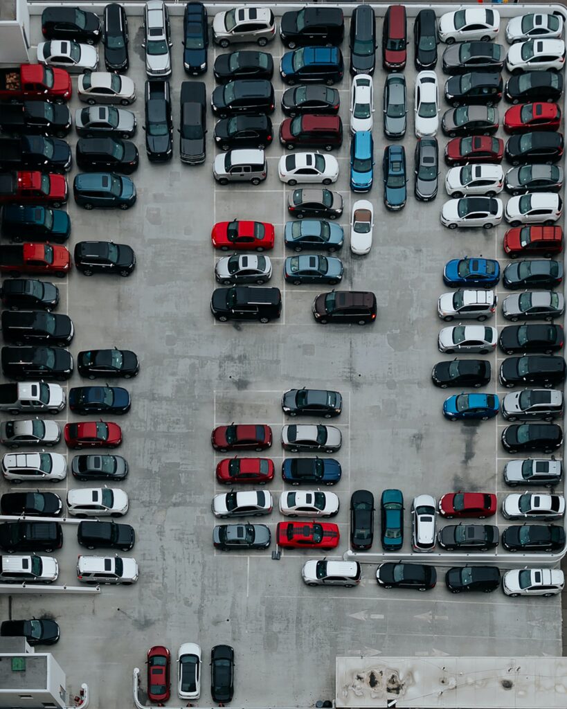 Cars parking in a parking lot. The photo is illustrative. Photo by Ivana Cajina on Unsplash.