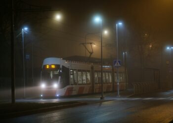 A tram gliding through the foggy winter streets of Kalamaja in Tallinn, Estonia. Photo: Unsplash.