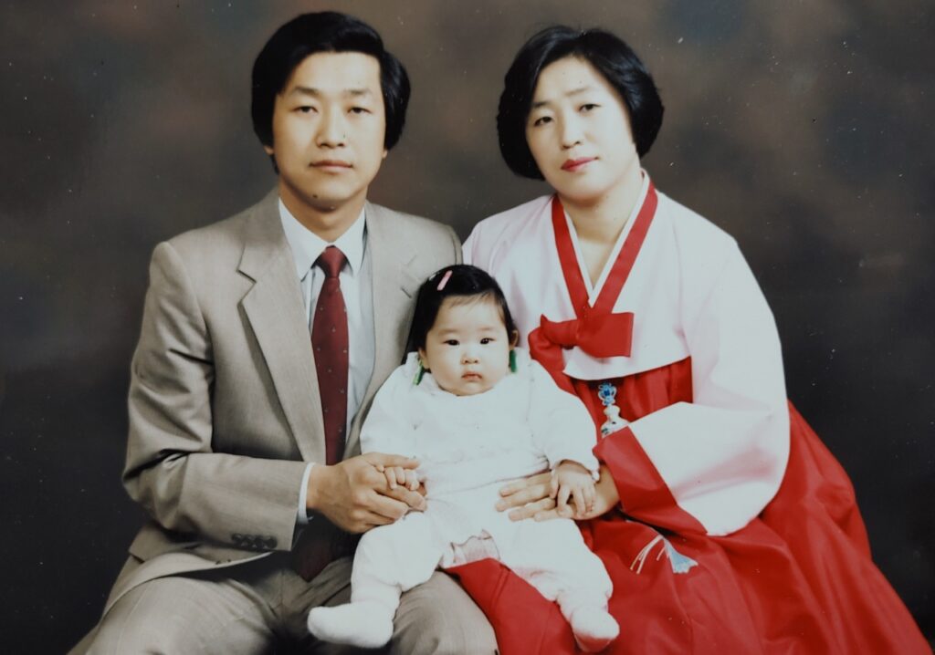 Little Soo-Young with her parents. Private collection.