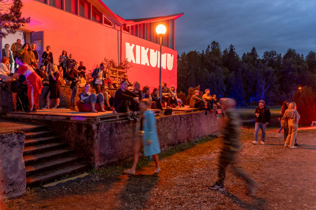 Set in a secluded landscape of forest and water, KiKuMu unfolded across four distinct stages – two indoors and two beneath the open sky, including one beside the lake. Photo by Andrea Forlani.