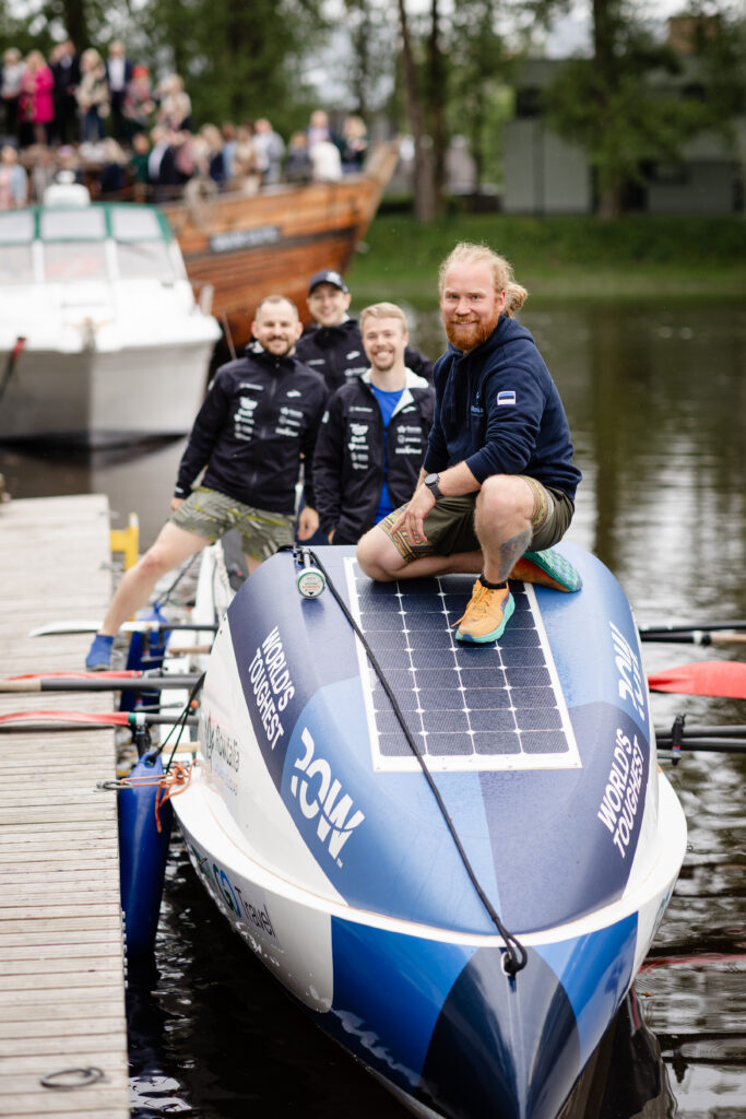 Team Rowtalia sitting on the boat that is going to take them across the Atlantic Ocean. Photo by Kaarel Kree.