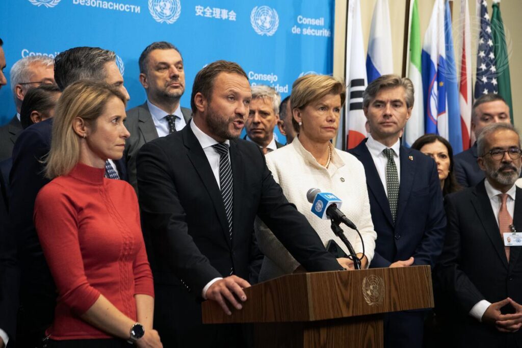 Margus Tsahkna (at podium), the Estonian foreign minister, addresses the press before an emergency Security Council meeting on threats to International Peace and Security. He was joined by the governments of Albania, Andorra, Australia, Austria, Belgium, Bosnia and Herzegovina, Canada, Croatia, Cyprus, Czechia, Denmark, Finland, Fiji, France, Georgia, Germany, Greece, Hungary, Iceland, Ireland, Italy, Japan, The Republic of Korea, Latvia, Liechtenstein, Lithuania, Luxembourg, Republic of Moldova, Monaco, Montenegro, The Netherlands, New Zealand, North Macedonia, Norway, Poland, Portugal, Romania, San Marino, Slovakia, Spain, Sweden, Switzerland, Türkiye, Ukraine, The United Kingdom, The United States of America, and the European Union. Photo by UN.