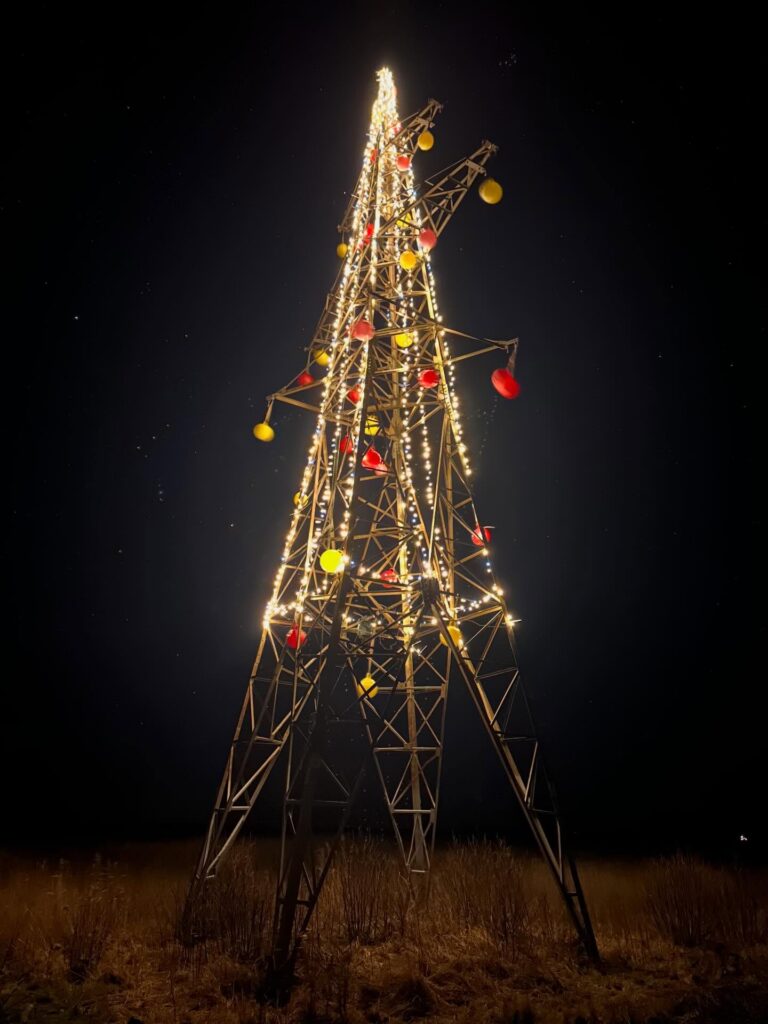 In Estonia, a disused power pylon on Saaremaa lights up as a Christmas tree, marking an unlikely environmental victory. Photo by Heiki Hanso.