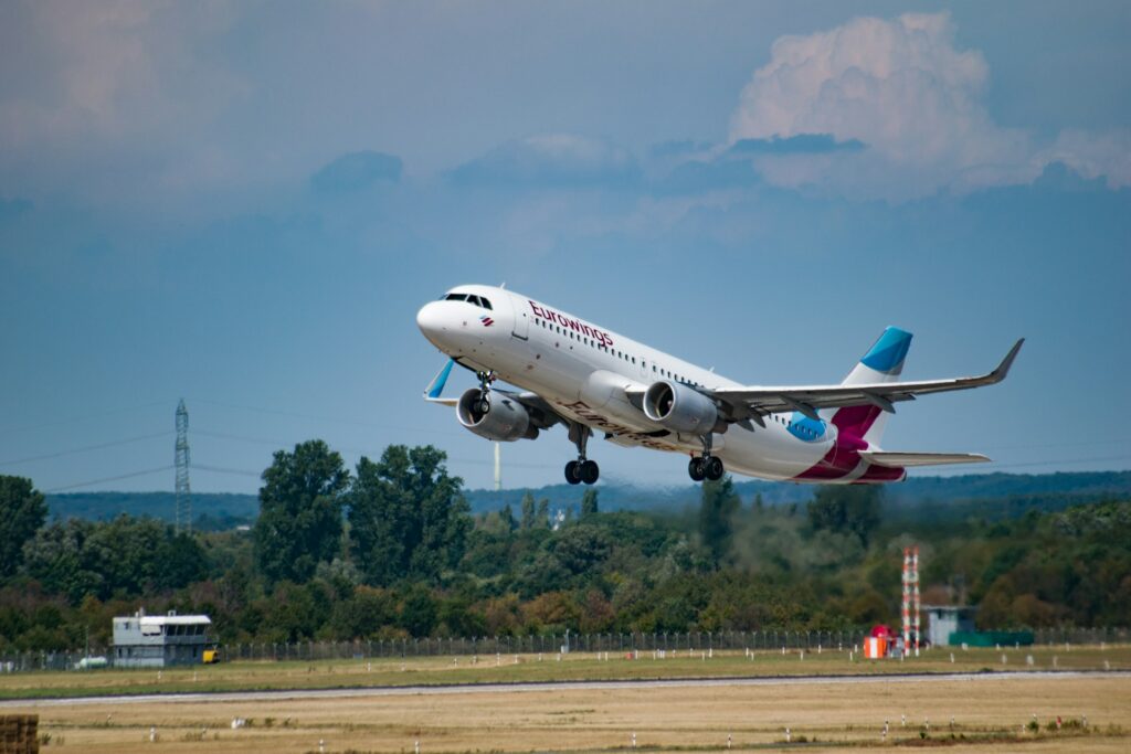 A Eurowings plane landing in Düsseldorf, Germany. Photo by Tim Dennert/Unsplash.