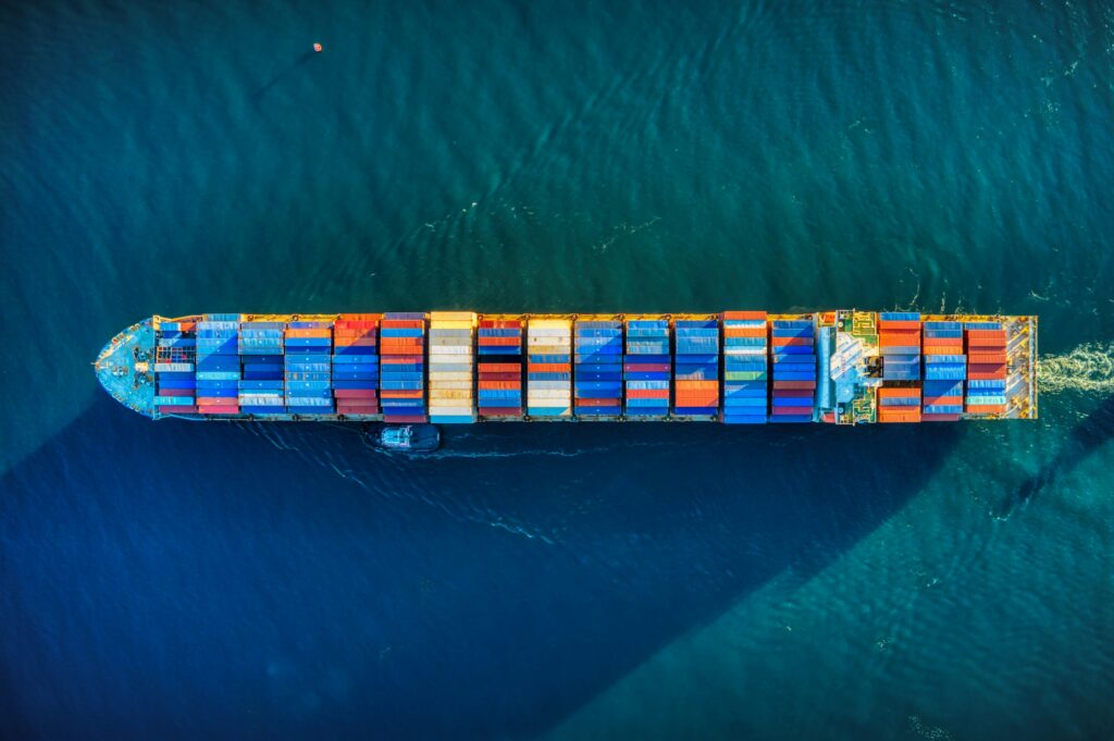 A cargo ship full of shipping containers. The image is illustrative. Photo by Venti Views on Unsplash.