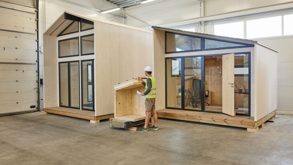 Manufacturing was the strongest driver of growth, with value added rising by 13.3 per cent. A worker inspects a wooden house structure in Estonia. Photo: Brand Estonia.