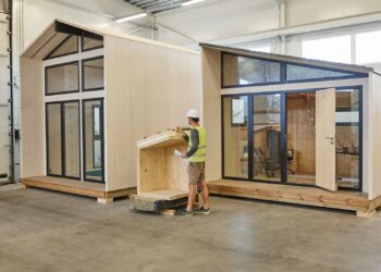 Manufacturing was the strongest driver of growth, with value added rising by 13.3 per cent. A worker inspects a wooden house structure in Estonia. Photo: Brand Estonia.