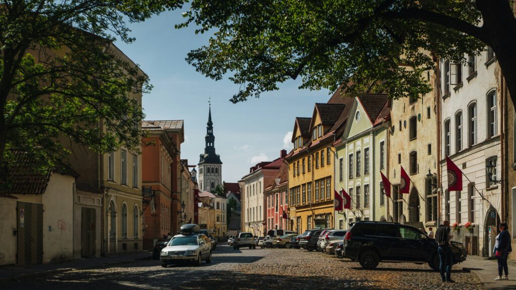 Lai Street in Tallinn’s Old Town, where parked cars interrupt one of the city’s most historic streetscapes. Photo by Nick Night on Unsplash.