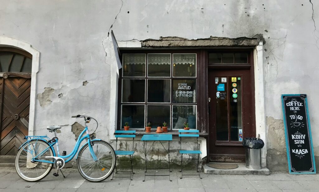 A small café in Tallinn’s Old Town, the kind of independent business that gives the historic centre its character. Photo by Sercan Selvi on Unsplash.