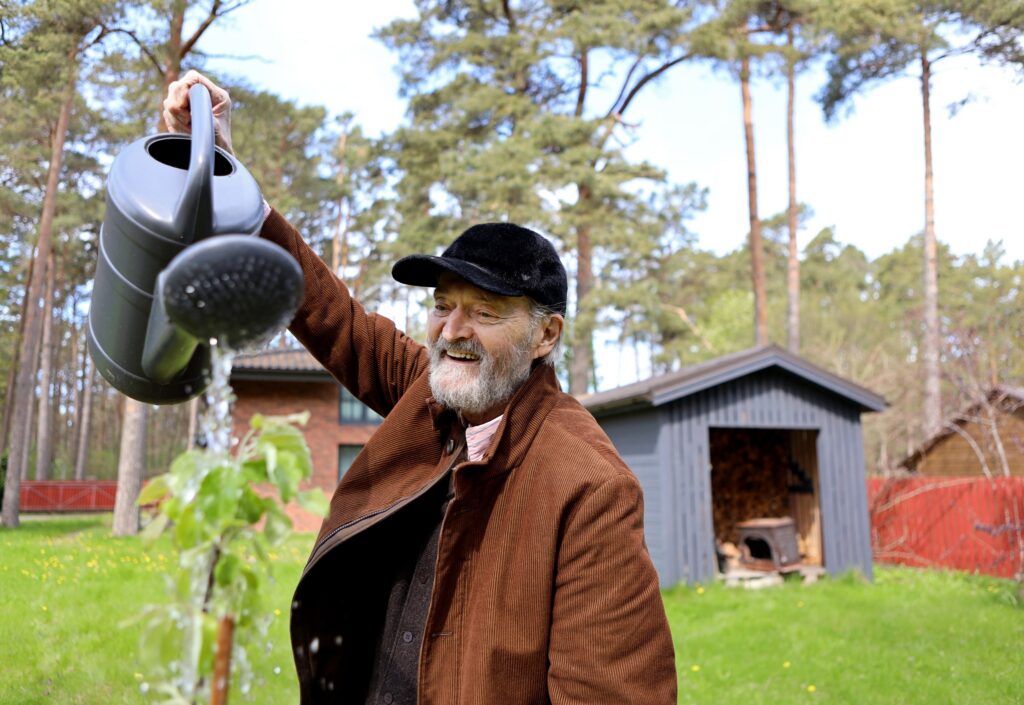 Arvo Pärt waters a young tree at the Arvo Pärt Centre in Laulasmaa, Estonia, on 15 May 2026. Photo by Birgit Püve / Arvo Pärt Centre.