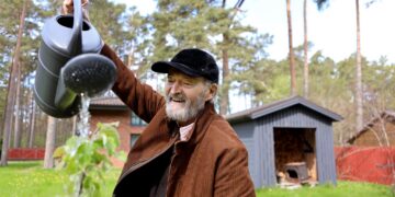 Arvo Pärt waters a young tree at the Arvo Pärt Centre in Laulasmaa, Estonia, on 15 May 2026. Photo by Birgit Püve / Arvo Pärt Centre.