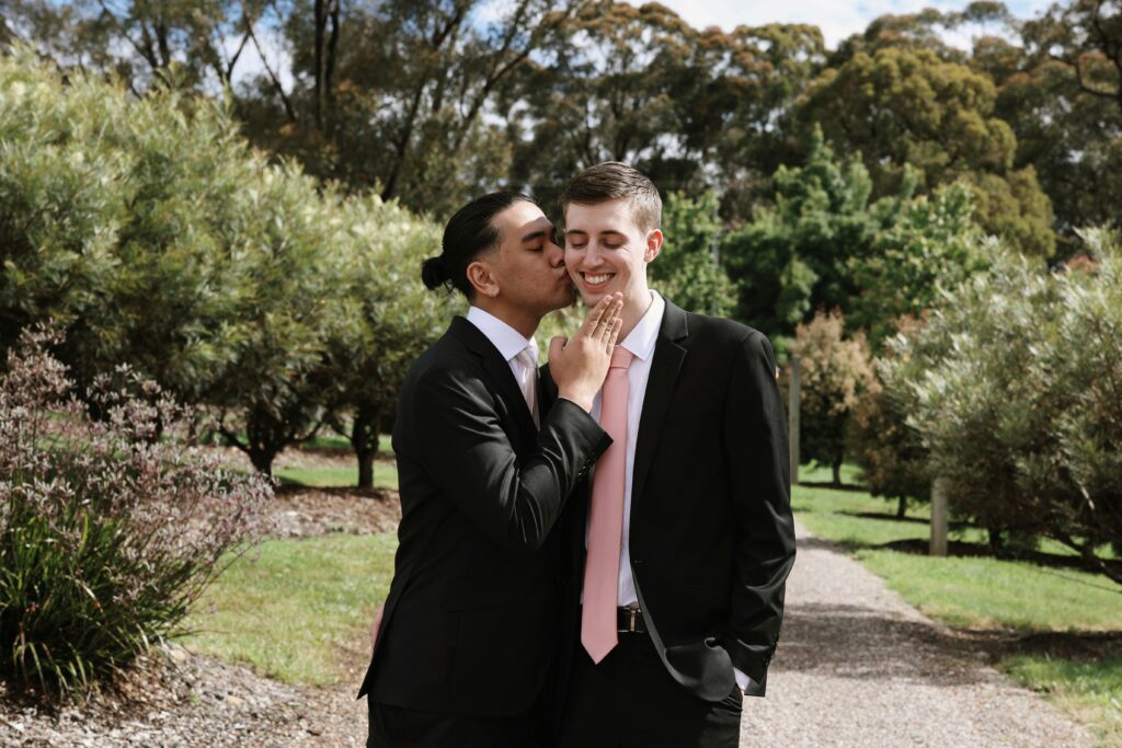 A same-sex couple celebrating their marriage. Photo by Joeyy Lee/Unsplash.