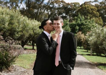 A same-sex couple celebrating their marriage. Photo by Joeyy Lee/Unsplash.