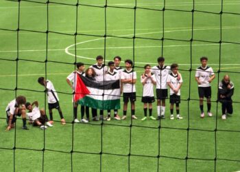 Players from FC Vaujours display a Palestinian flag during the Tallinn Cup under-14 tournament in Tallinn. Photo courtesy of Kert Valdaru.