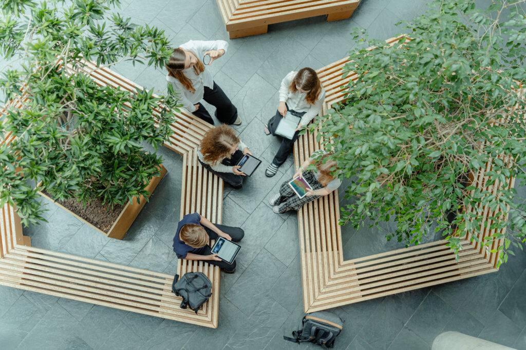 Students use tablets in a school atrium. The latest PISA assessment highlights Estonia’s digital strengths, while also raising questions about distraction and the decline in reading skills. Photo by EIS.