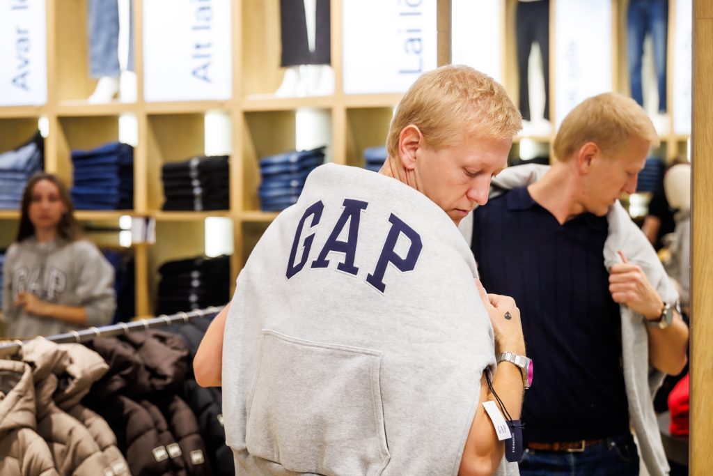 Estonian choreographer Ženja Fokin trying on a Gap hoodie. Photo by Kalev Lilleorg.